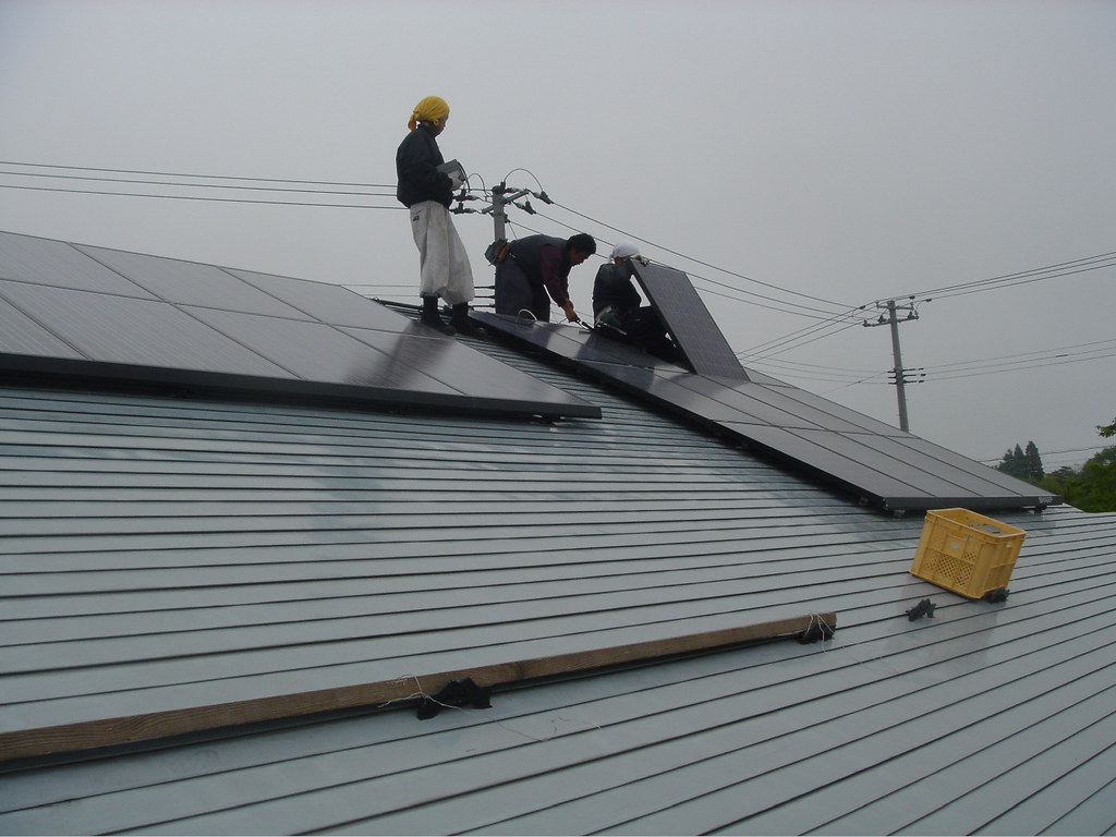 Technicians servicing a solar array